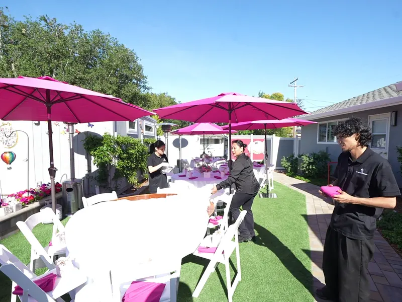 Buffet line set with chafing dishes and garnished platters before service