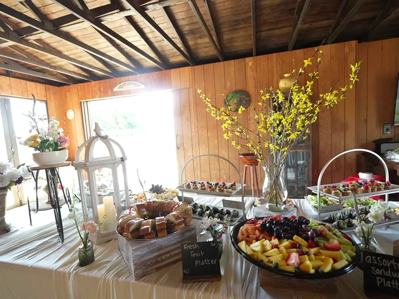 Appetizer station arranged with dips, breads, and skewers
