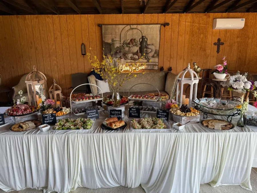 Grazing table of cured meats, artisan cheeses, marinated olives, seasonal fruit and grilled breads styled for a Livermore wine country reception by Winslow's Catering Livermore